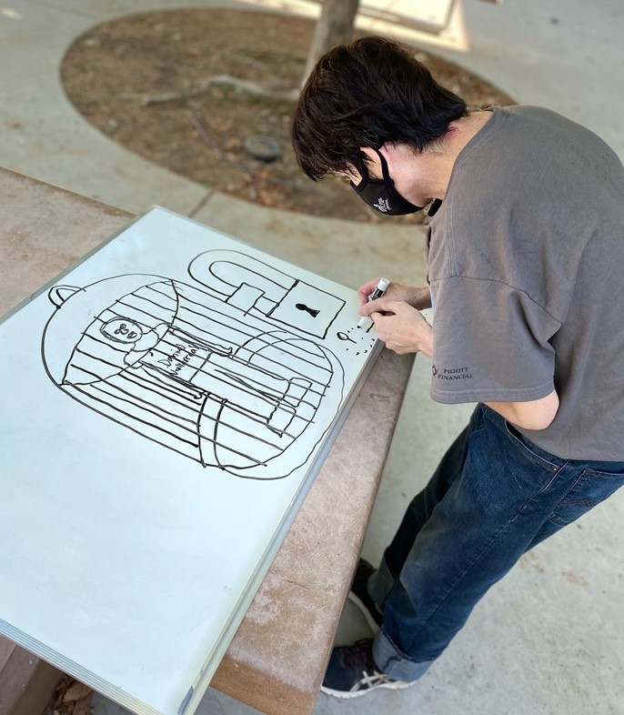 UCPCC student Jason participates in Art in the Park.